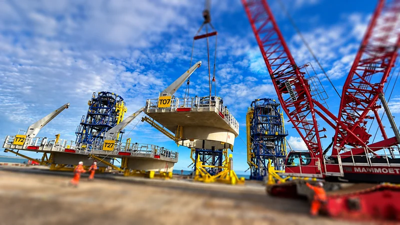 Crane lifting a secondary steel platform